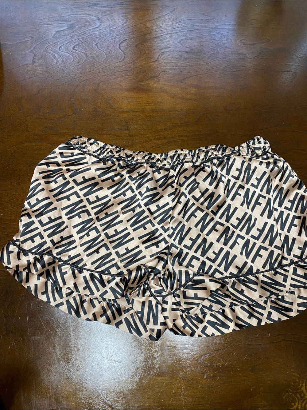 Logo Print Beige and Black Ruffle Hem Shorts